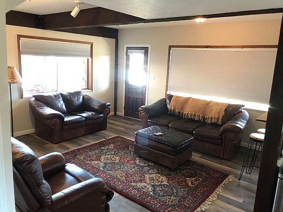 Living area adjoining to kitchen & bathroom.