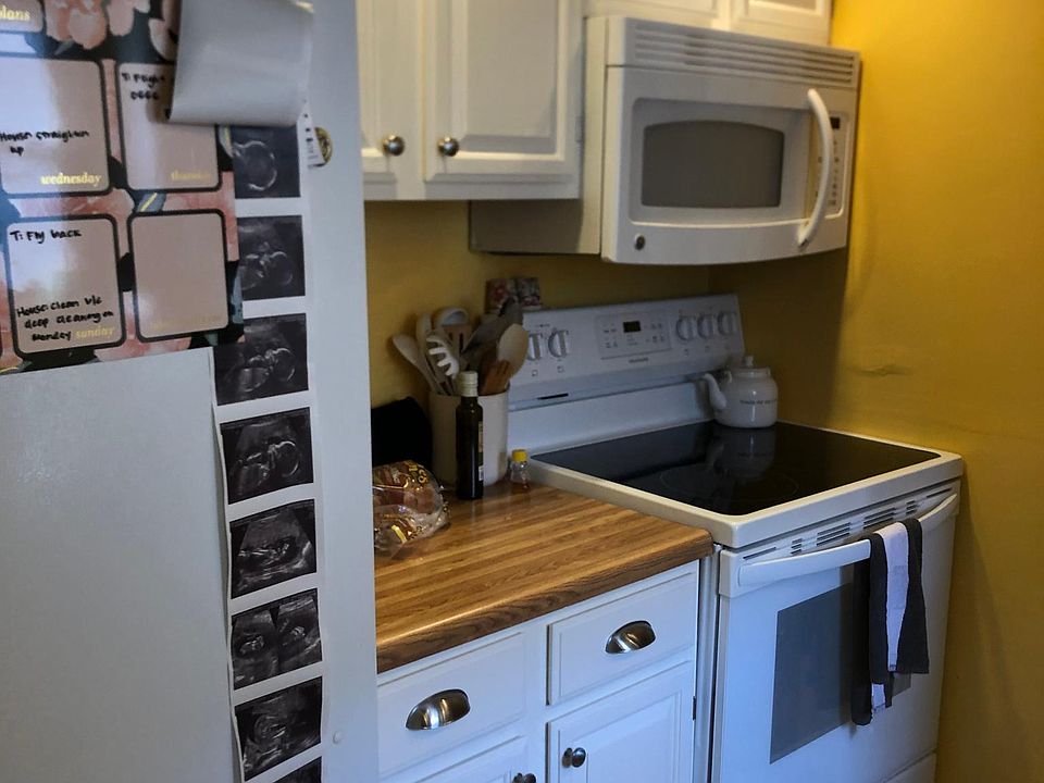Kitchen with newly professionally painted cabinets.
