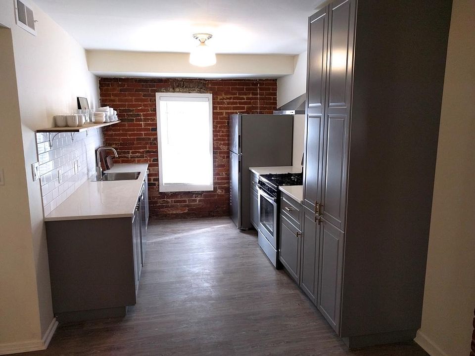 Brand new kitchen with stainless appliances and quartz count