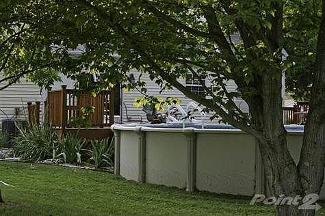 Deck has LOCKING gates on each side. All sitting on almost 2 acres!