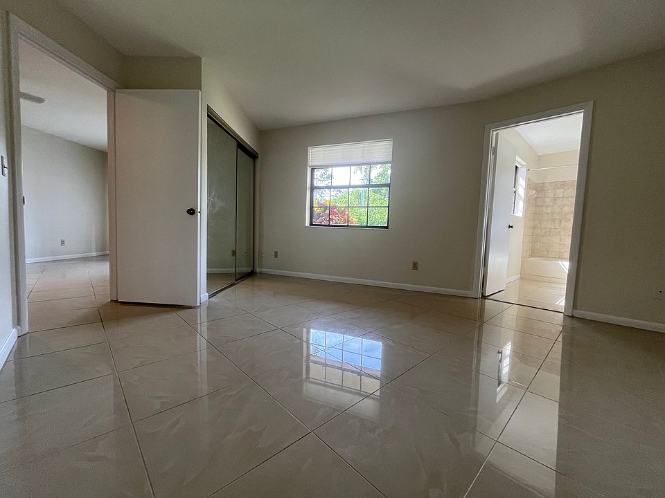 North end of living room connects to bedroom