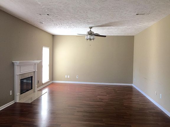 living room w wood burning fireplace