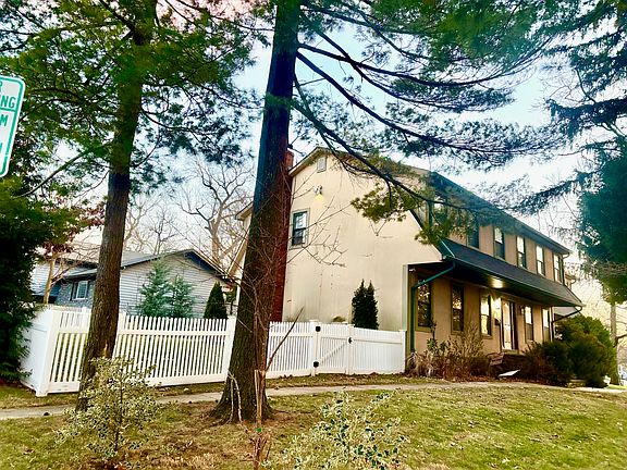 Front side to Elm St. corner with fenced side yard view.