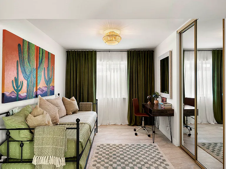 Guest room with twin trundle bed, working desk and ample closet space.