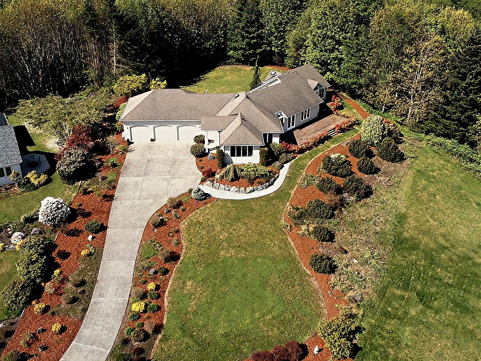 Beautifully landscaped .8 ac lot with greenbelt behind