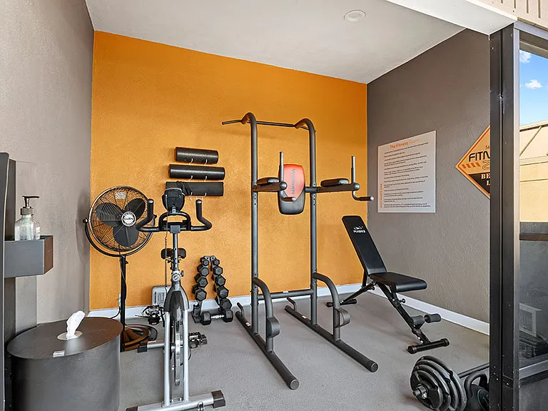 On-site fitness center with weight equipment.