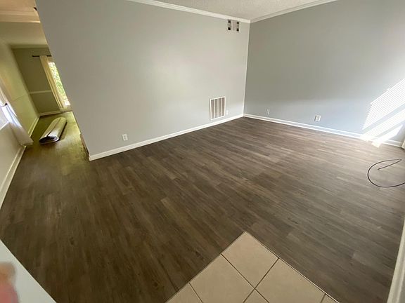 Spacious living room with engineered hardwood floors