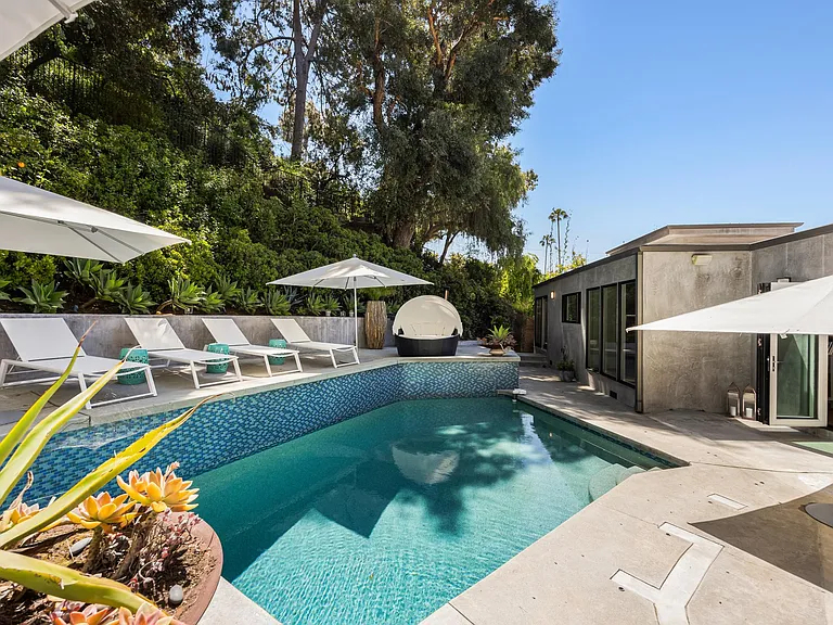 Refresh and unwind under the California sun in the tranquil oasis of the pool at the Beverly Hills Canyon Villa.