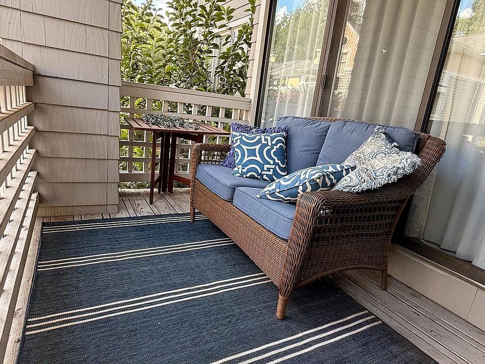 Spacious deck overlooking pool.