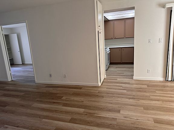 Front entrance looking to the right. Bedroom on the left, kitchen on the right.
