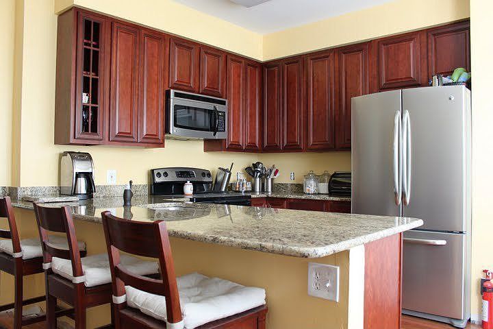 New cabinets, granite, appliances, Brazilian Cherry hardwood floors