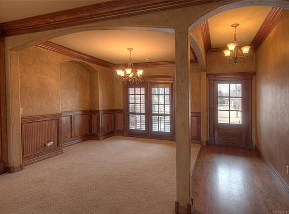 Front door on the right, dining area on the left.