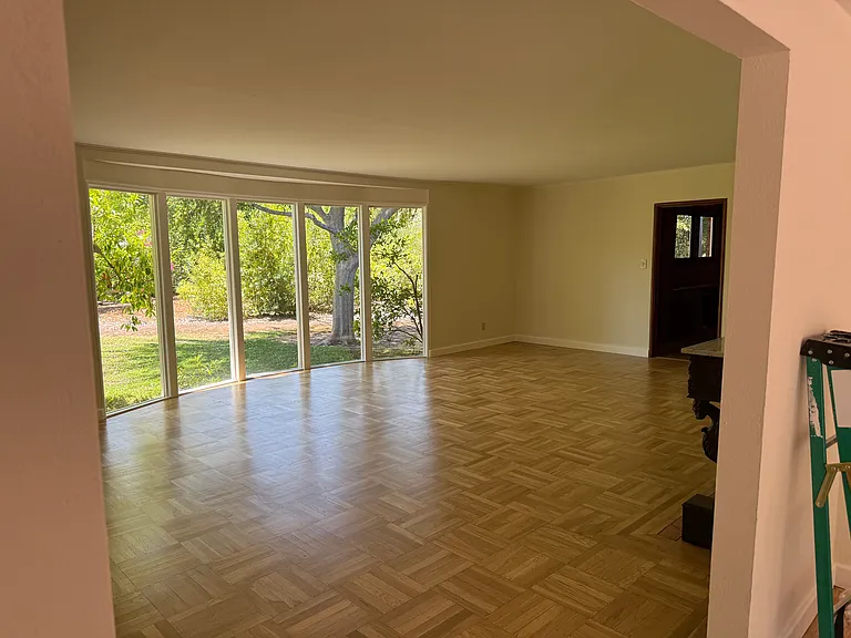 Living room with ceiling to floor windows.
