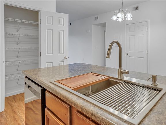 Brand new deep kitchen sink with cutting board and drying rack accessories