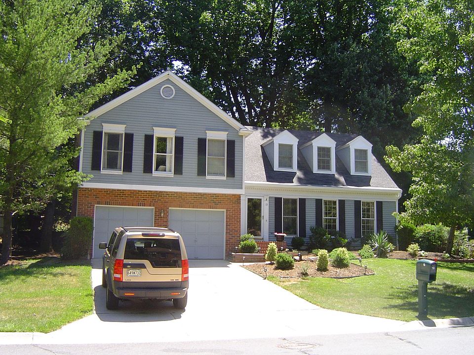 Frontal View: 13 Hidden Valley Ct. enjoys park-like setting on one-third acre