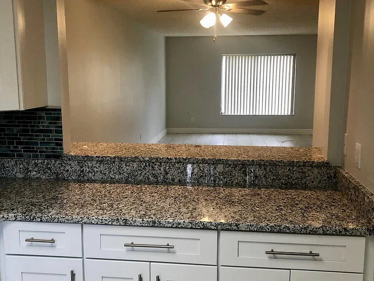 Looking from kitchen area toward the living and dining area.