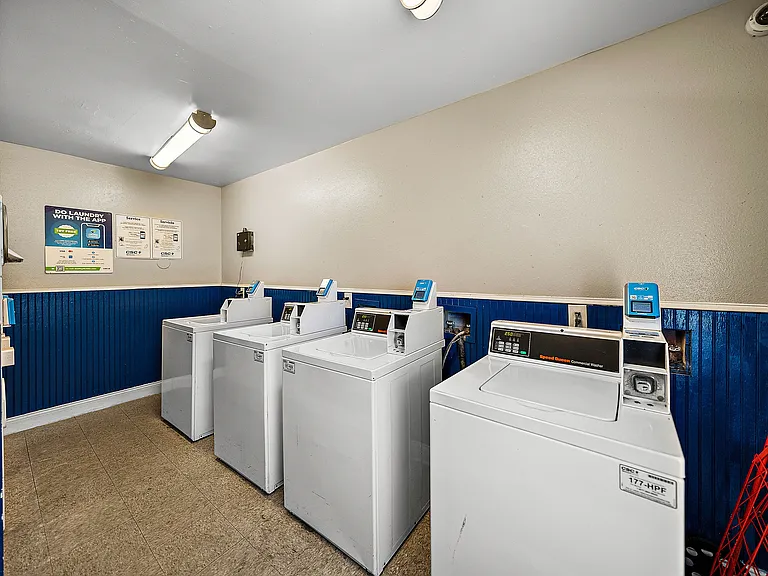 Convenient community laundry room with multiple washing machines