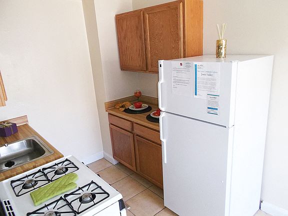 Galley Kitchen With White Appliances