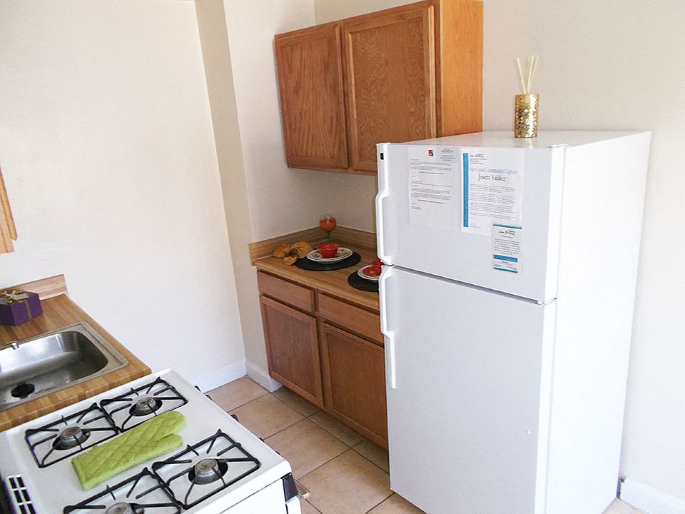 Galley Kitchen With White Appliances