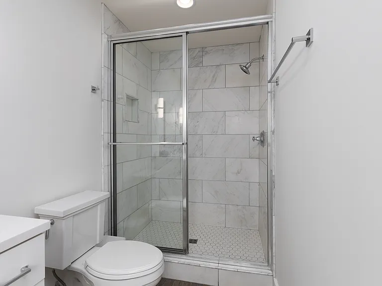 Full bathroom 2 is connected to bedroom 2 with a stand up shower.