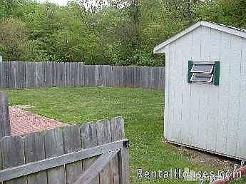 Shed in fenced back yard
