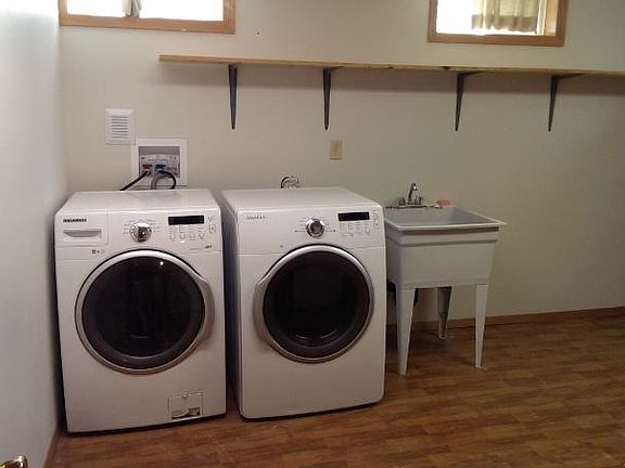 High-end front load washer/dryer in laundry room