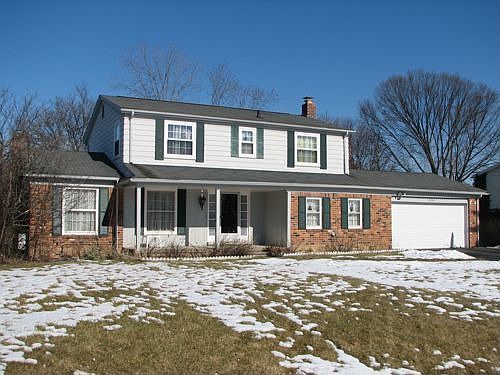A nice 4 BR house backs a wooded stream.