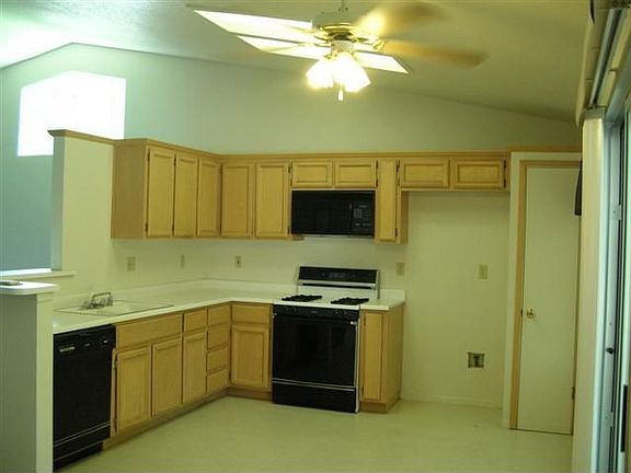 Kitchen area with closet pantry