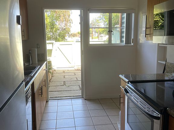 Two parking spots outside of patio gate