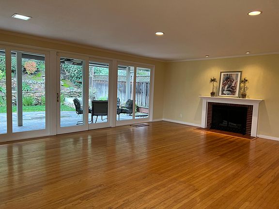 Great Room Style Living /Dining Room Overlooking Private Lush Rear Gardens