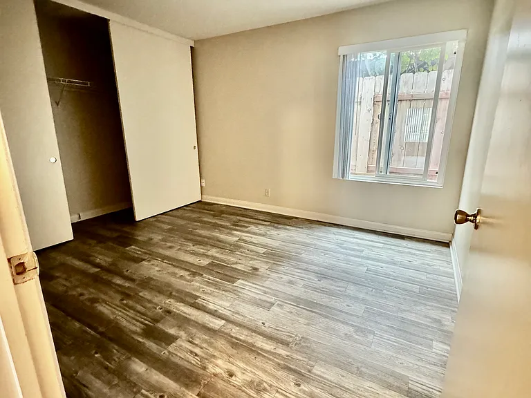 Bedroom with full length wall closet
