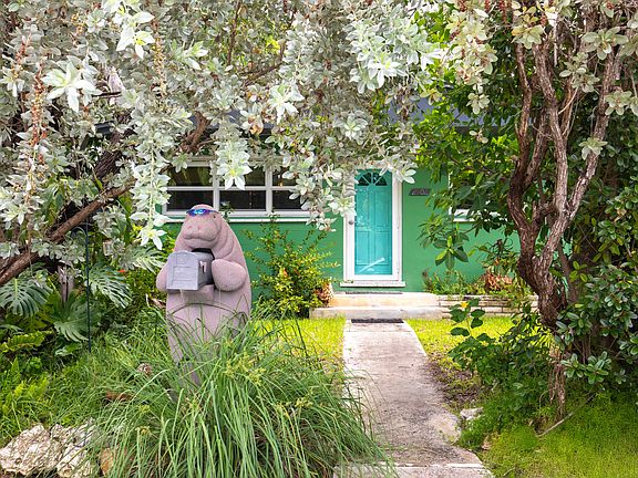 Experience tropical Key West living in this private waterfront retreat. Features a large pool, lush landscaping, outdoor shower, and fire pit. Three bedrooms, 1.5 baths, high-speed Wi-Fi, and a fully equipped kitchen _ pet friendly and serene.