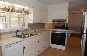 Kitchen, view to bkyd, open to Fam.Rm., door to carport,laundry. 