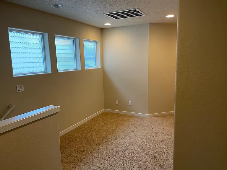 Multi-use open area at top of stairs - reading nook?