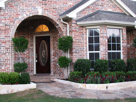 Beautiful Porch with a faux stone walkway.