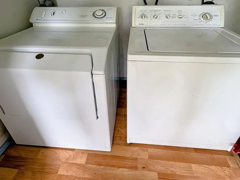 Laundryroom right outside kitchen door. Must use only septic safe products.