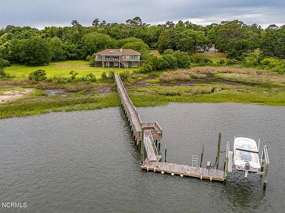 View of Dock and 2 Boat Slips. One Wet Slip and One Motorized Lift.