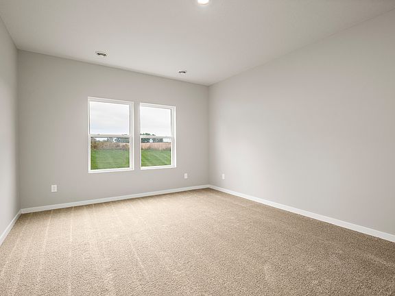 The master bedroom is spacious with a large window