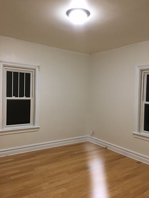 Bedroom with pear tree outside.