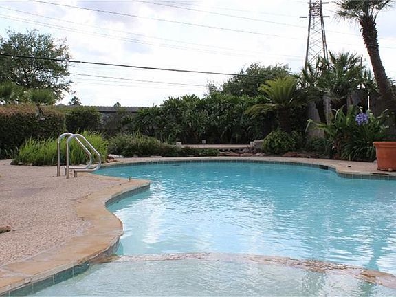 Crystal Clear Pool with Hot Tub, and Tranquil Water Fall.