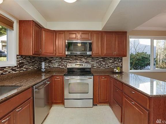 Electric stove, microwave and dishwasher. 