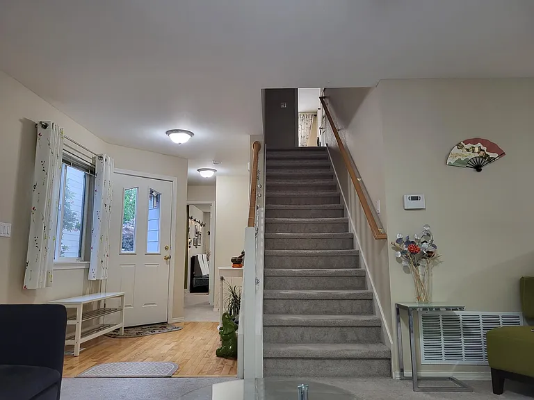Stairs to Upper Floor, Entrance and Main Floor Bedroom 1 View