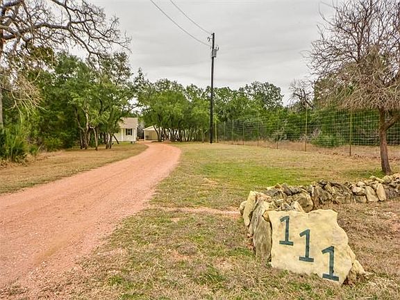 Long driveway leads to private yard space