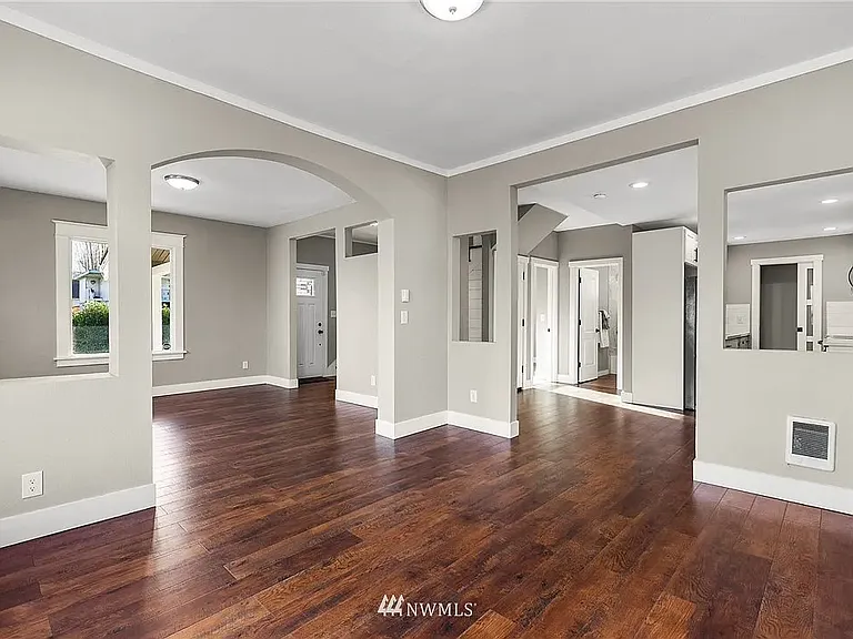 The spacious open-concept design creates an effortless flow between the living, dining, and kitchen areas, perfect for everyday living and entertaining.