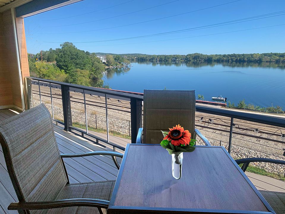 Dining space on the covered balcony with an expansive view.