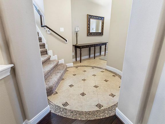 The home has many beautiful architectural details, including the title insert that accents the rotunda just past the entry.
