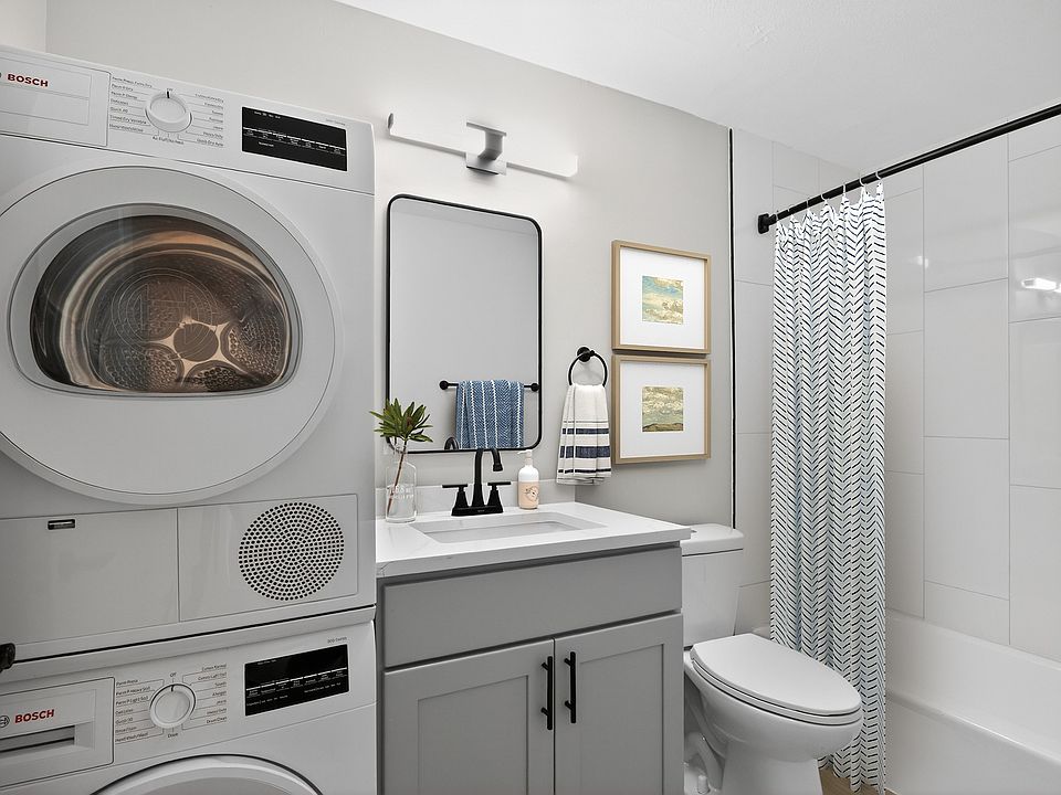 Elevate your lifestyle at Eagle Rock Apartments at West Hartford. This stylish bathroom features modern amenities, including in-unit laundry and sleek finishes for ultimate convenience. Don't miss outschedule your tour today!