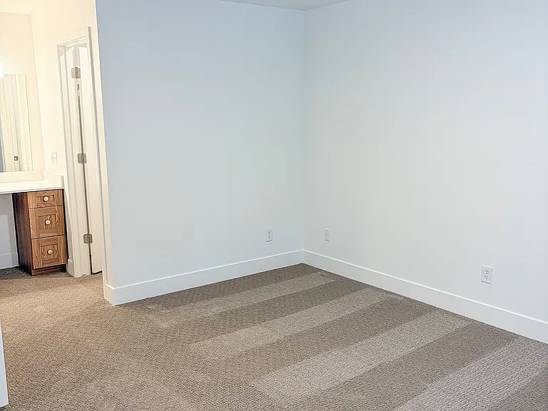 Generously sized bedrooms offer flexibility for work, relaxation, and everything in between.
