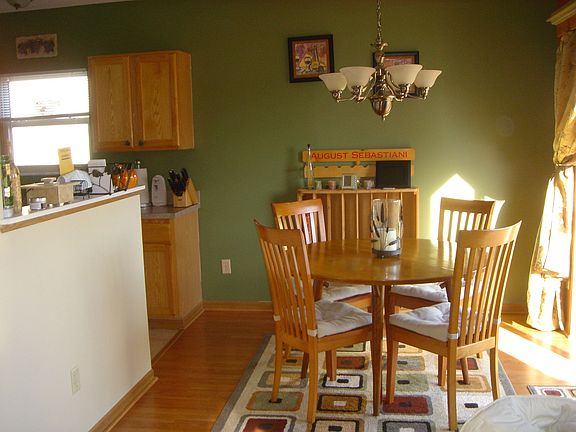 Eating area off of kitchen with sliding glass door that leads to deck.