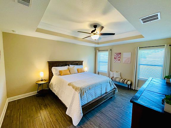 Luxurious master suite with en suite, full bath, walk in closet, Smart TV, lamps with chargers, comfortable Cal King mattress, blackout shades and ceiling fan. All necessary for a great night''s sleep!